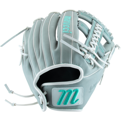 The Marucci Palmetto 45A5 12" Fastpitch Glove (MFG3PL45A5FP-GY) features light gray leather, teal accents, white laces, a braided post, and teal-embroidered Marucci branding.