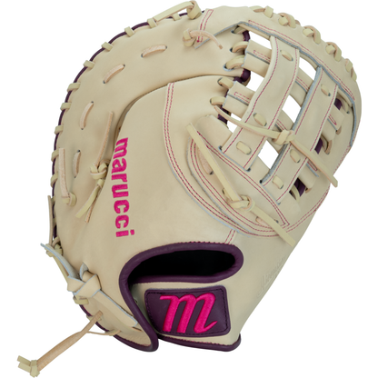 The Marucci Ascension 39S2 13″ Fastpitch First Base Mitt (MFGASFP39S2-CM/PR) is a beige glove featuring a pink M on the wrist, “marucci” stitched on the thumb, durable steerhide shell leather, tan laces, and an H-Web design.