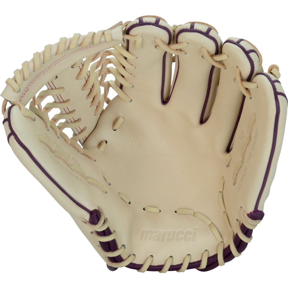 The Marucci Ascension 97A6 12.5″ Fastpitch Glove (MFGASFP97A6-CM/PR) is a cream-colored glove crafted from premium steerhide leather, featuring striking purple lacing. Shown open with the palm facing up, it highlights intricate stitching and Marucci branding inside the glove and showcases a classic T-Web design.