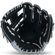 The Marucci NightShift CHUCK T 11.5" Baseball Glove (MFGNTSHFT-0103) offers bold black and white style plus top performance, making it ideal for players seeking quality and flair on the diamond.
