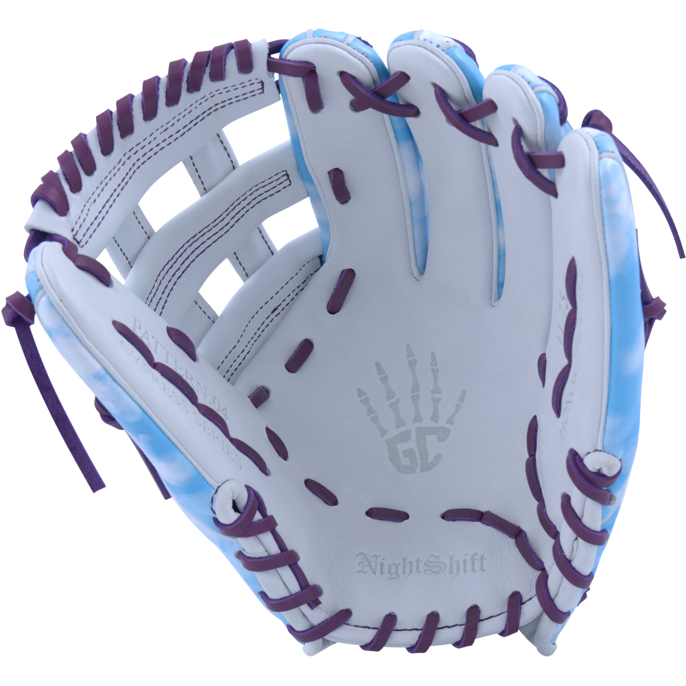 The Marucci NightShift Cloudy 11.75" Baseball Glove (MFGNTSHFT-0402) features a white and light blue design, purple lacing, a skeletal hand palm graphic, Japanese-tanned steerhide, and "NightShift" embossed near the wrist.