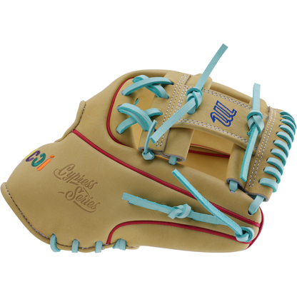 The Marucci NightShift Coloring Book 11.5" Glove features Japanese-tanned steerhide, tan color, blue laces, red stitching, and vibrant embroidered logos—including "Cypress Series"—from the standout Marucci NightShift collection.