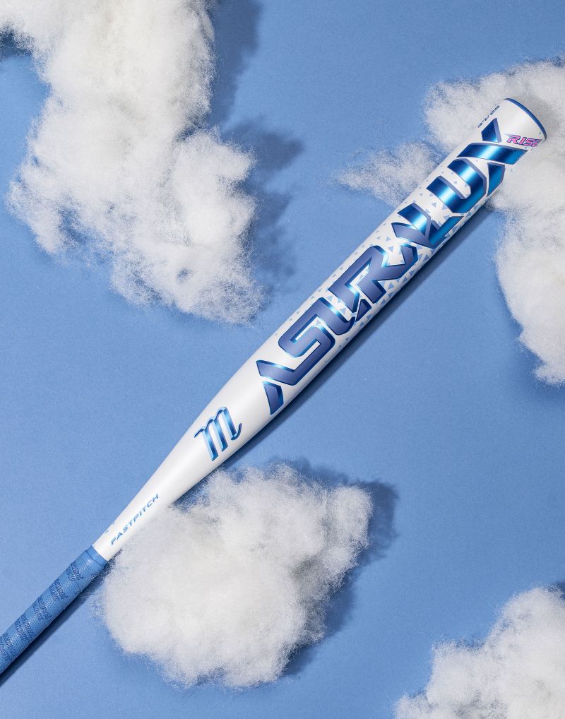 A white Marucci 2027 ASURA Lux Rise (-10) Fastpitch Softball Bat (model MFPASLR10) with blue branding lies diagonally on a blue background, surrounded by fluffy, cloud-like cotton pieces.