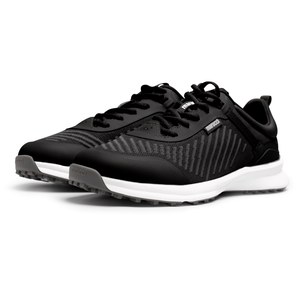 The Marucci CFT Turf Shoes (MFWCTT) by Marucci feature black mesh uppers, white soles, black laces, advanced cushioning, and a traction rubber outsole, shown side by side on a white background.