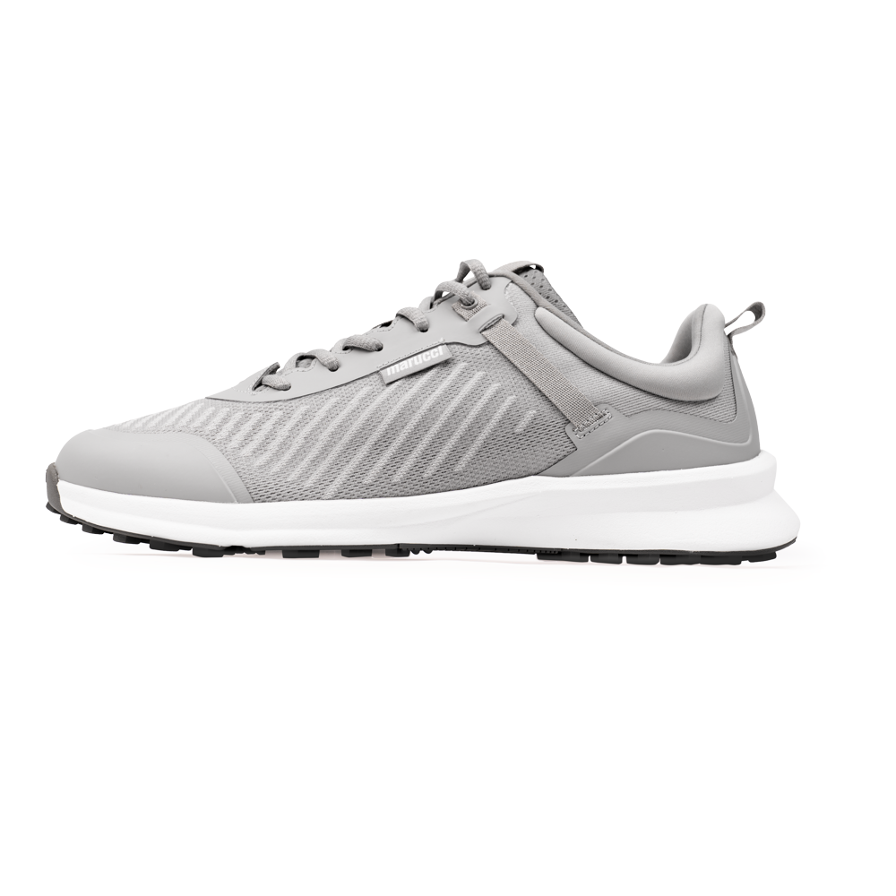 The Marucci CFT Turf Shoes: MFWCTT feature a light gray mesh upper, synthetic overlays, advanced cushioning, white midsole, traction rubber outsole, and heel pull tab. Side profile shown on a white background.
