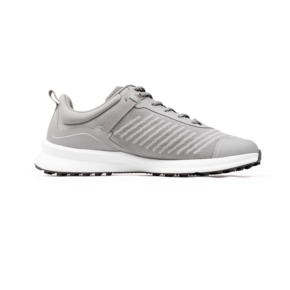The Marucci CFT Turf Shoes: MFWCTT in light gray feature a white sole, lace-up front, subtle side stripes, and advanced cushioning, shown in side profile on a white background.