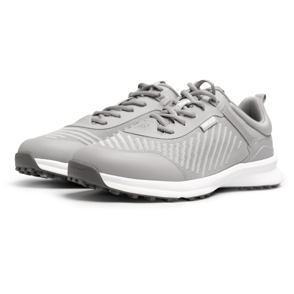 A pair of modern, light gray Marucci CFT Turf Shoes: MFWCTT by Marucci features mesh uppers, white soles with traction rubber outsoles, and advanced cushioning, displayed side by side on a white background.