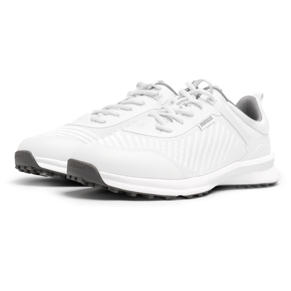 A pair of Marucci CFT Turf Shoes (MFWCTT) in white with gray soles and laces is shown on a plain white background, featuring textured side panels, Marucci branding on tongue and side, and advanced cushioning for comfort.