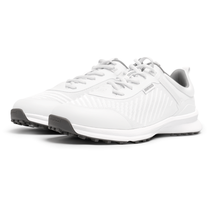 A pair of Marucci CFT Turf Shoes (MFWCTT) in white with gray soles and laces is shown on a plain white background, featuring textured side panels, Marucci branding on tongue and side, and advanced cushioning for comfort.