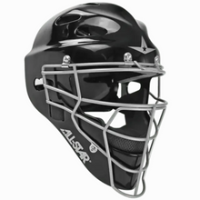 The All Star Top Star Hockey Style Catcher’s Helmet: MVP-3 features a black helmet shell with a silver metal face guard, ventilation holes, padded interior, and prominent All Star branding on the side. Inspired by traditional hockey headgear and part of the Top Star Series, this helmet is designed for baseball or softball catchers and offers enhanced durability and comfort behind the plate for superior head and face protection.