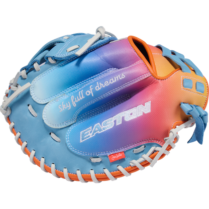 The Easton Jen Schro MYWHY 33" Fastpitch Catcher's Mitt features a vibrant blue, purple, pink, and orange gradient, white lacing, plus "sky full of dreams" and EASTON printed on this premium catcher's mitt.