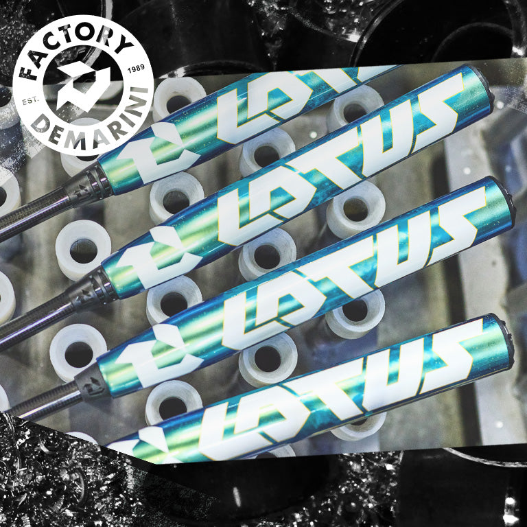 Three DeMarini Lotus (-11) Fastpitch Softball Bats, featuring teal and white graphics, are displayed diagonally across white plastic tubes. The DeMarini Factory logo in the top left highlights the brand’s innovation in softball bats.