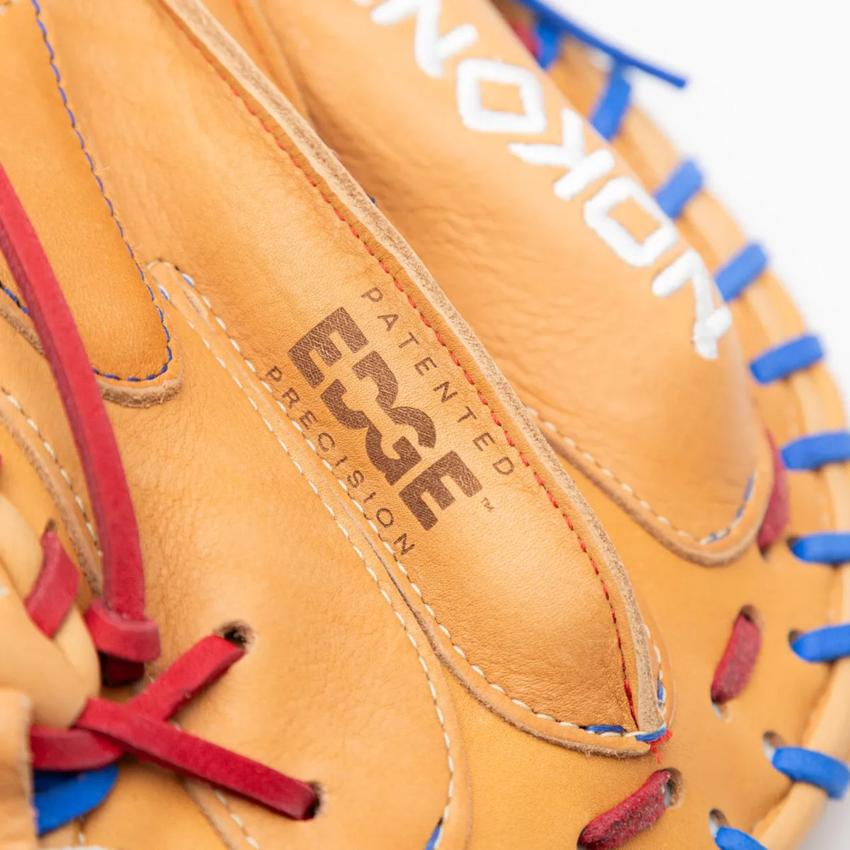 Tan leather Nokona S1 All-American 32″ Baseball Catcher’s Mitt: S1-EP2POP with red and blue lacing and the word EDGE embossed on the palm.