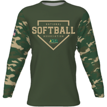 The DSG Apparel National Softball Association NSA CAMO Sublimated Long Sleeve Shirt features moisture-wicking fabric, camo sublimation, an American flag patch, and a bold NSA logo on the chest.