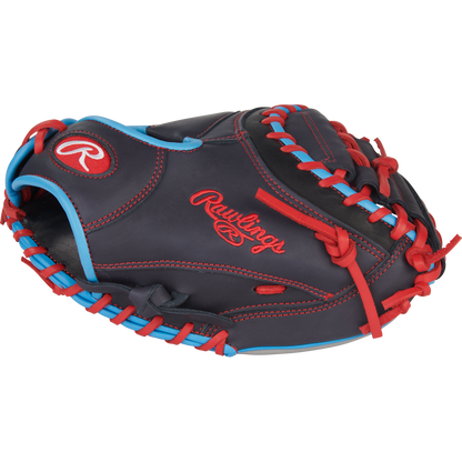 The Rawlings NXT 32.5″ Baseball Catcher’s Mitt (NXTCM325UNG) features a dark pro-soft leather design with striking red stitching and accents, complemented by blue trim and the iconic Rawlings logo embroidered in red on the side. Designed for youth players, this mitt delivers superior comfort and durability behind the plate.