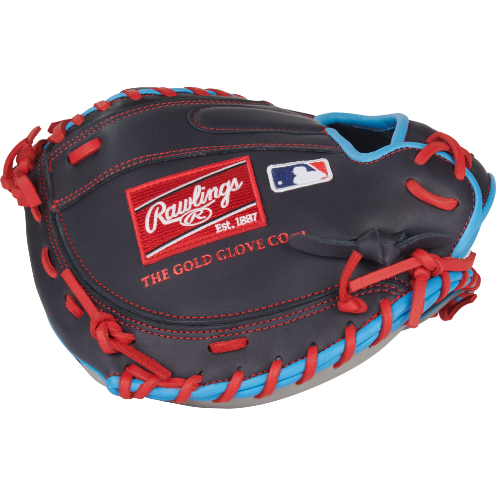 The Rawlings NXT 32.5″ Baseball Catcher’s Mitt (NXTCM325UNG) is a black and red youth catcher’s mitt with blue accents, featuring the iconic Rawlings logo patch and MLB logo on the back. Crafted from pro-soft leather for enhanced comfort and durability, it’s an excellent choice for young catchers.