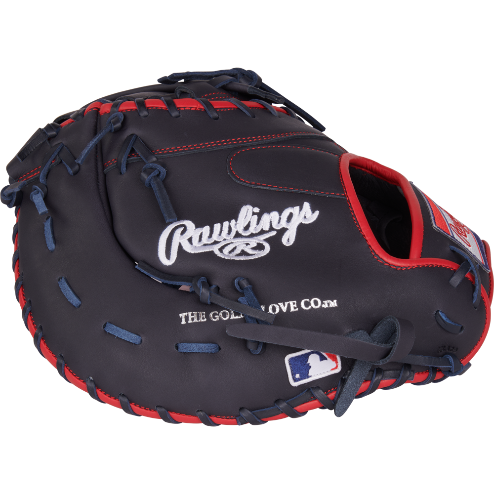 The Rawlings NXT 12.25" Baseball First Base Mitt (NXTDCTU-10N) features dark blue leather with red stitching, Rawlings branding, and an MLB patch—perfect for serious players seeking a top-tier travel ball glove.