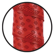 Close-up of a red, textured handlebar tape with small perforations and the word Lizard embossed diagonally across the surface. The tape is wrapped in overlapping layers inside a black circle.