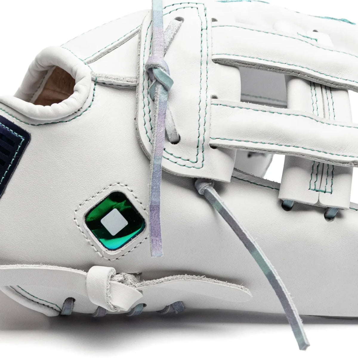 Close-up of a white Nokona Halo 12″ Fastpitch Glove: WHT-EP1200H with teal stitching, iridescent laces, and a diamond-shaped green emblem on the side.