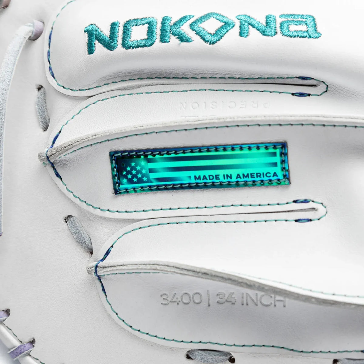 Close-up of a white Nokona Halo 34″ Fastpitch Catcher’s Mitt: WHT-EPV3400H with a teal embroidered logo, a holographic Made in America flag patch, and debossed text reading 3400 | 34 INCH.