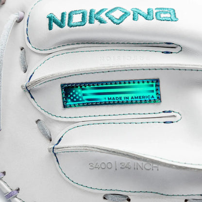 Close-up of a white Nokona Halo 34″ Fastpitch Catcher’s Mitt: WHT-EPV3400H with a teal embroidered logo, a holographic Made in America flag patch, and debossed text reading 3400 | 34 INCH.