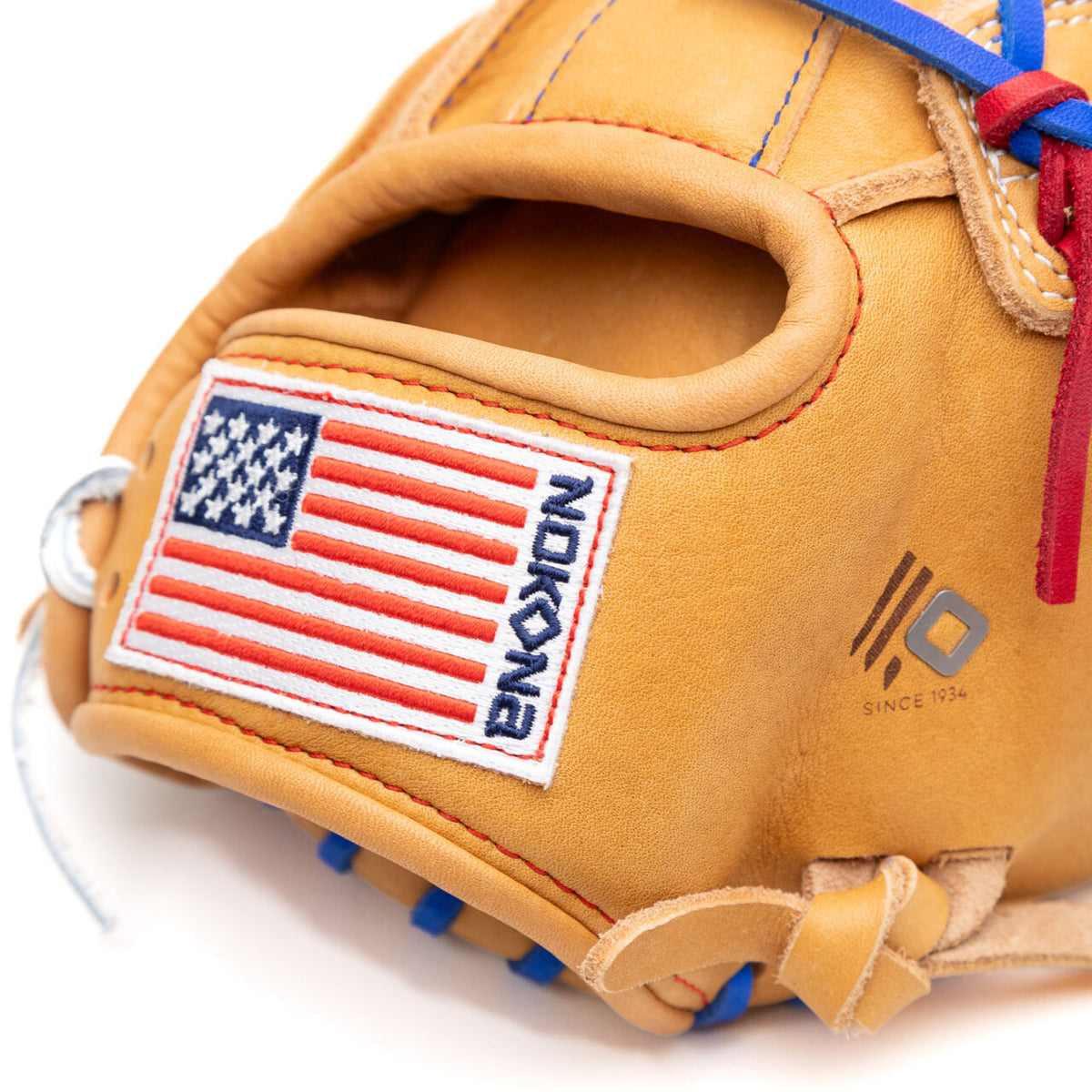 Tan Nokona S1 All-American 12.25″ Baseball Glove: S1-EP600POP featuring a patch of the American flag next to a blue brand logo, with blue and red laces.