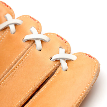Close-up of a tan Nokona S1 All-American 12.5″ Baseball Glove: S1-EP800POP made of Supersoft Steerhide leather, featuring white leather lacing and red stitching along the top edges.