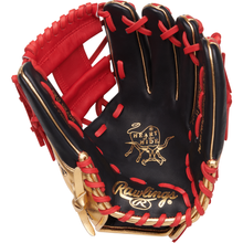 The Rawlings Heart of the Hide 11.5" Baseball Glove (PROGOLDYIX) features black steer hide leather with red laces, gold trim, and displays the Rawlings and Heart of the Hide logos on the palm.
