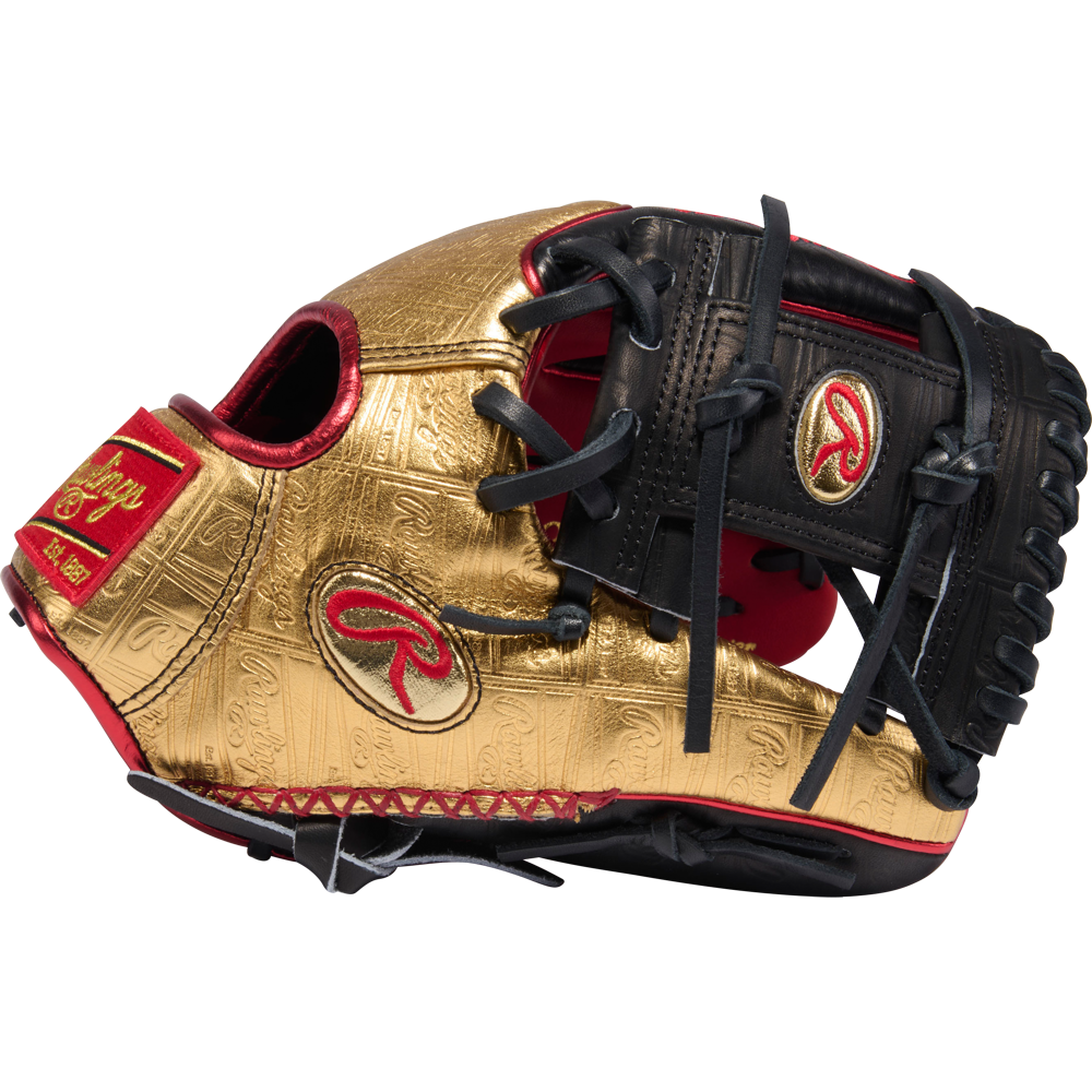 The Rawlings Heart of the Hide 11.5" Baseball Glove - RGGC June 2026: PROGOLDYX stands out with its gold and black design, red accents, intricate patterns, and prominent Rawlings logos on the side and wrist strap.