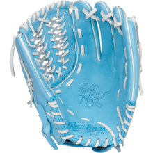 The Rawlings Heart of the Hide 12.5" Fastpitch Glove (PRO125SB-15CB) features light blue leather, white laces, and the Rawlings logo stamped on the palm.