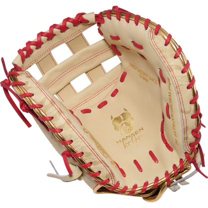 The Rawlings Heart of the Hide 33" Kinzie Hansen K9 Fastpitch Catcher's Mitt (PROCM33FP-24CS) features tan leather with red lacing, a bulldog logo, an open web design, and PROSPECT 2409 and WANTSEEN on the palm for top performance.