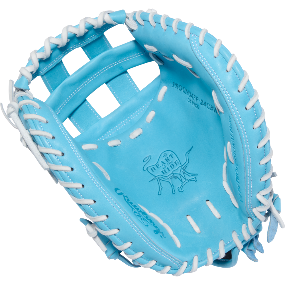 The Rawlings Heart of the Hide 34" Fastpitch Catcher's Mitt (PROCM34FP-24CBW) features a light blue design with white laces and an embossed logo in the palm area.