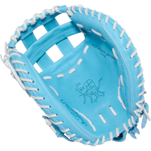 The Rawlings Heart of the Hide 34" Fastpitch Catcher's Mitt (PROCM34FP-24CBW) features a light blue design with white laces and an embossed logo in the palm area.