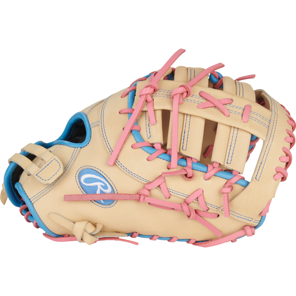 The Rawlings Heart of the Hide 13" Fastpitch First Base Mitt (PRODCTSB-10CCB) features a tan design with pink laces, blue accents, and blue stitching—ideal for players seeking a reliable first base glove.