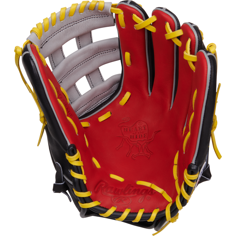The Rawlings Heart of the Hide 12.25" Baseball Glove (PROKB17SB) features a red, black, and yellow design with yellow laces and white accents, shown palm up against a white background. Inspired by Kris Bryant for pro-level play.