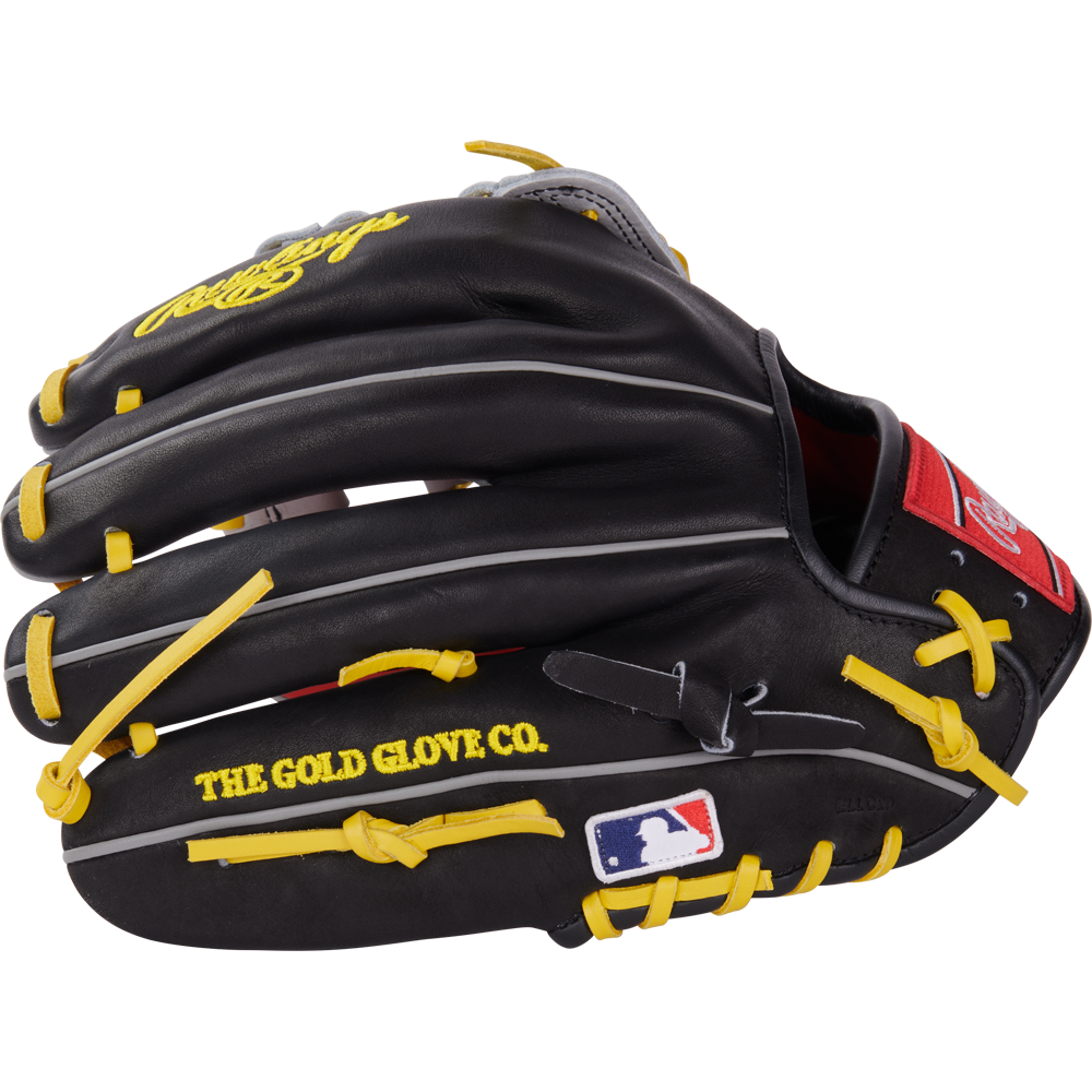 The Rawlings Heart of the Hide 12.25" Baseball Glove (PROKB17SB) is black with yellow laces, “THE GOLD GLOVE CO.” text, MLB logo on the thumb, white and gray accents, and a red Rawlings patch near the wrist.
