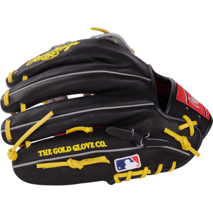 The Rawlings Heart of the Hide 12.25" Baseball Glove (PROKB17SB) is black with yellow laces, “THE GOLD GLOVE CO.” text, MLB logo on the thumb, white and gray accents, and a red Rawlings patch near the wrist.