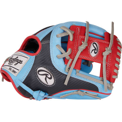 The Rawlings Heart of the Hide 11.5" Baseball Glove (PROR204-2CBS) features a blend of light blue, red, gray, and black with gray laces, bold red webbing, and white Rawlings logos on the wrist strap and thumb.
