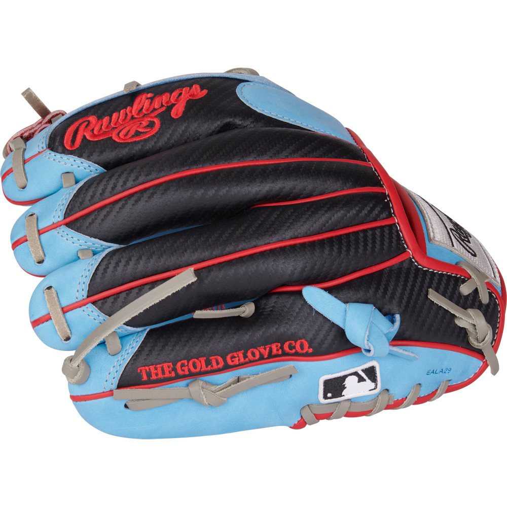 The Rawlings Heart of the Hide 11.5" PROR204-2CBS infield glove features a black, blue, and red design with tan laces, a carbon fiber-like texture, THE GOLD GLOVE CO. and MLB logos printed on it.