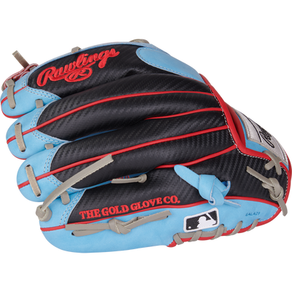 The Rawlings Heart of the Hide 11.5" PROR204-2CBS infield glove features a black, blue, and red design with tan laces, a carbon fiber-like texture, THE GOLD GLOVE CO. and MLB logos printed on it.
