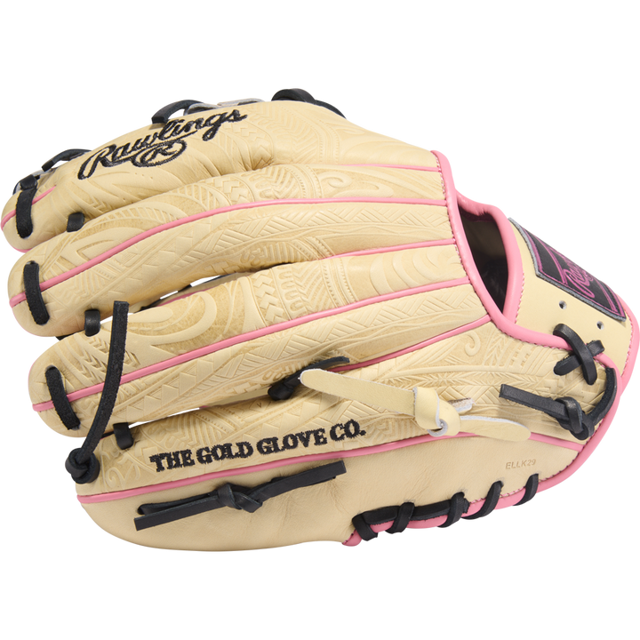 The Rawlings Heart of the Hide 11.5" Baseball Glove (PROR204-2CPB) features a tan design with black laces, pink accents, engraved patterns, and "THE GOLD GLOVE CO." printed in black on the thumb.