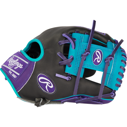 The Rawlings Heart of the Hide 11.5" Baseball Glove (PROR204-2DSTP) features black leather, purple and teal accents, purple laces, an open web for fast transfers, and Rawlings logos on the thumb, wrist, and strap.