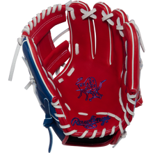 A Rawlings Heart of the Hide 11.5" Baseball Glove (PROR204-2SRW) in red, white, and blue features white lacing and a blue stitched logo on the palm, shown against a plain white background.