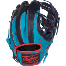 The Rawlings Heart of the Hide 11.5" Color Sync Baseball Glove (PROR204-2TE) features turquoise and navy leather with red trim, swirl patterns, and dark laces, displayed on a white background.