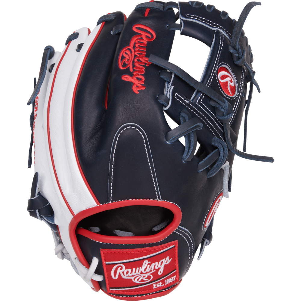 The Rawlings Heart of the Hide ContoUR 11.5" Baseball Glove (PROR204U-2N) showcases a navy blue and white design with red accents, complete with the Rawlings logo and Est. 1887 on the wrist strap.
