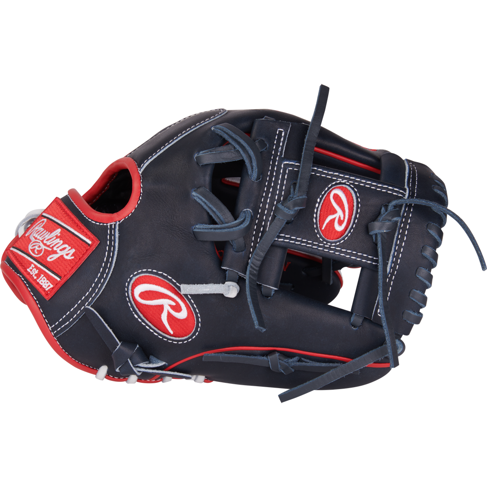 The Rawlings Heart of the Hide ContoUR 11.5" Baseball Glove (PROR204U-2N) features a dark navy design with red and white accents, black laces, and Rawlings logos on the thumb and wrist strap in the signature ContoUR Fit style.