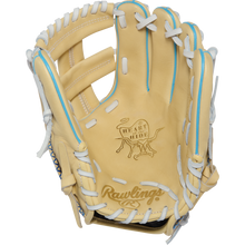 A tan Rawlings Heart of the Hide 11.5″ Baseball Glove (PROR204W-1CCB) with white and blue laces features visible Rawlings branding and the Heart of the Hide logo on the palm. The open, upward-facing glove showcases its premium R2G construction and craftsmanship.