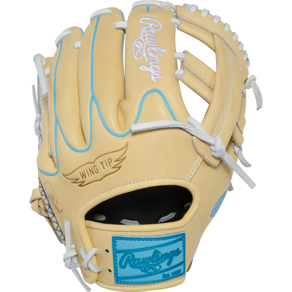 A tan Rawlings Heart of the Hide 11.5″ baseball glove (model PROR204W-1CCB) features white laces, light blue accents, “Wing Tip” text on the thumb, and a blue Rawlings patch near the wrist.