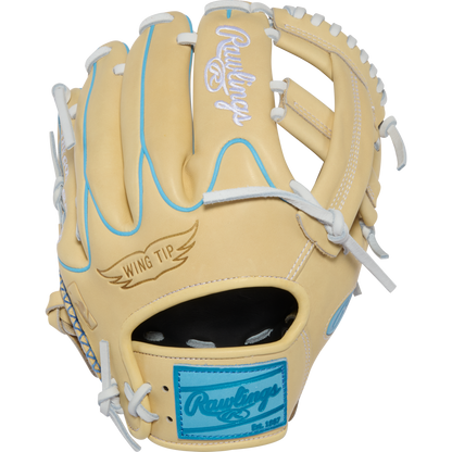 A tan Rawlings Heart of the Hide 11.5″ baseball glove (model PROR204W-1CCB) features white laces, light blue accents, “Wing Tip” text on the thumb, and a blue Rawlings patch near the wrist.
