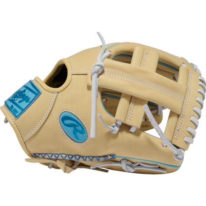 A side view of the Rawlings Heart of the Hide 11.5″ Baseball Glove (model PROR204W-1CCB) from the RGGC August 2026 collection is shown on a plain white background. This tan leather infield glove features white laces, blue accents, and a distinctive blue Rawlings logo patch.